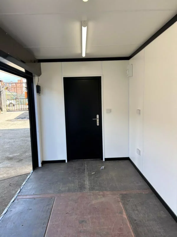 Steel storage container with roller shutter door